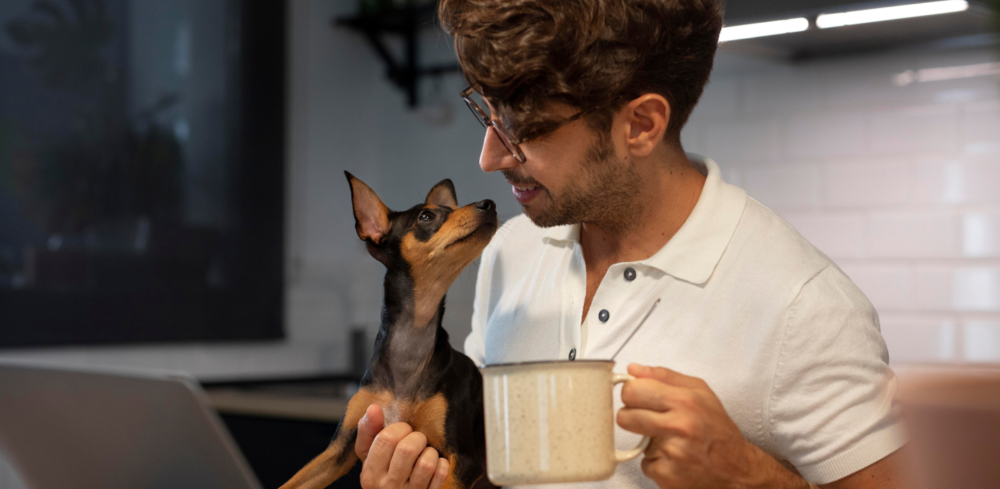 Small dog in mens arms